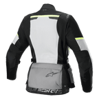 Alpinestars Stella Andes Air Drystar® Jacke, Damen-Motorrad-Tourenjacke, Rückansicht, Eisgrau, Dunkelgrau und Schwarz, mit großem weißen Mesh-Rückenpanel, grauer Aufbewahrungstasche am Rücken mit Logo, gelben Hi-Viz-Akzenten und Textilkonstruktion für Belüftung und Schutz.