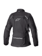 Alpinestars Stella Bogota' Pro Drystar® damesjas, zwart, achteraanzicht van een textiele adventure touring motorjas met een groot wit Astar-logo, opbergzak op de onderrug met merknaam en reflecterende accenten op de schouders