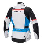 Alpinestars Stella Honda Andes V3 Drystar® damesjas, achteraanzicht, Ice Gray met blauwe en felrode accenten, opvallende zwarte HONDA-branding op de rug, Alpinestars-logo op de schouder en onderrug, verstelbare tailleriem, adventure touring textiel motorjas