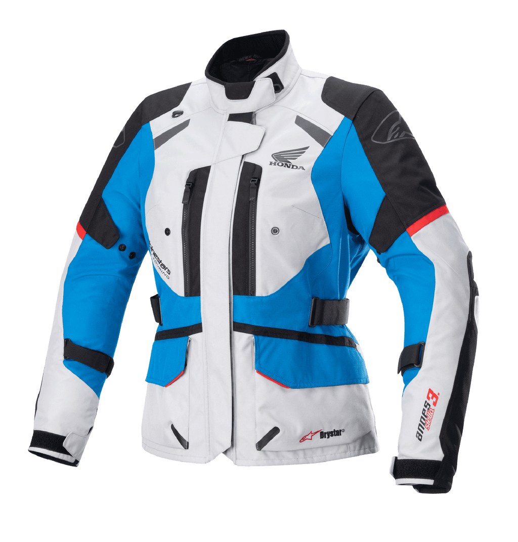 Alpinestars Stella Honda Andes V3 Drystar dames motorjas, motor touringjas, lichtgrijs, blauw en felrood, waterdichte textielconstructie met Honda wing-logo, ventilatieopeningen met rits en verstelbare taillebanden