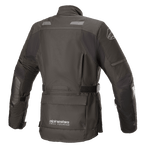 Alpinestars Stella Andes V3 Drystar® damesjas, zwart en donkergrijs, achteraanzicht met waterdichte textielconstructie, grote utility-zak op de onderrug, verstelbare tailleband en reflecterende veiligheidsaccenten.