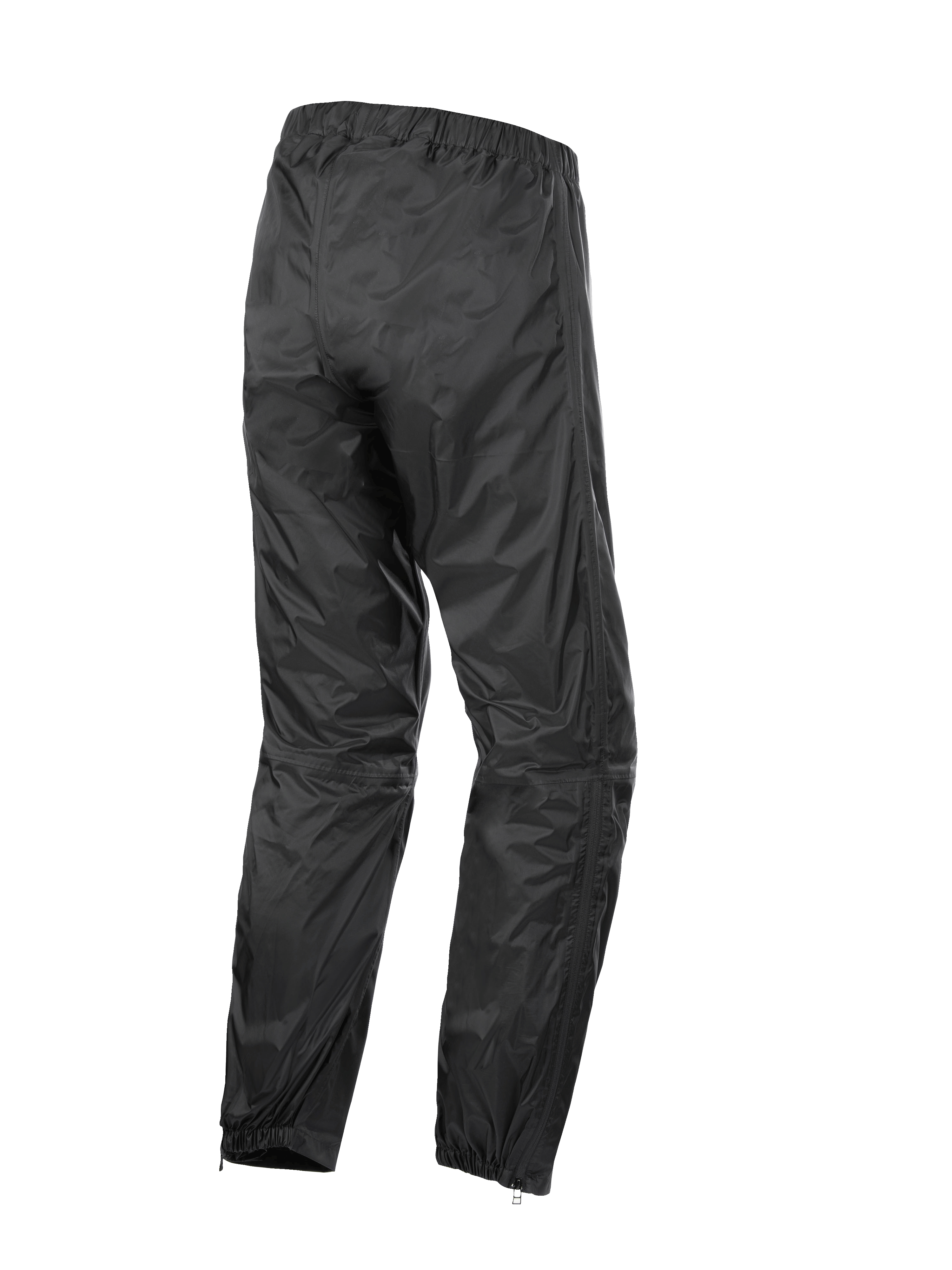 Pantalon Alpinestars Hurricane Rain V2, surpantalon de moto imperméable, noir, vue de dos montrant la taille et les chevilles élastiquées, tissu laminé léger résistant au vent avec fermetures éclair au bas des jambes pour un accès facile aux bottes, équipement de protection pour la route et le touring aventure