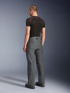 Alpinestars Borrego Drystar® Pants, Adventure Motorcycle Pants, Anthracite Gray, rear view, featuring a waxed-canvas look with cargo pockets, paired with a black t-shirt and riding boots, durable design for road and adventure touring