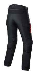 Pantalon Alpinestars Honda Bogota' Pro Drystar®, pantalon de touring aventure moto, noir avec marquage HONDA rouge, vue arrière présentant des panneaux d'aisance en accordéon à la taille, des sangles de réglage aux mollets et une construction textile durable pour la conduite aventure multi-saisons.
