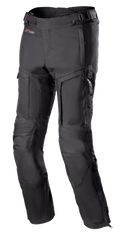 Pantalon Alpinestars Bogota Pro Drystar 3 Seasons, pantalon de moto touring noir, avec ventilations zippées sur les cuisses, panneaux extensibles en accordéon aux genoux, sangles de réglage à la taille et tissu textile résistant avec logo Drystar.