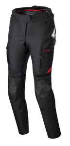 Pantalon femme Stella Honda Andes V3 Drystar®, pantalon de moto en textile, noir avec des accents rouge vif, logos Honda et Alpinestars, poches cargo avec liseré rouge, empiècements renforcés aux genoux, sangle de réglage à la taille et doublure intérieure rouge à la taille