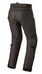 Alpinestars Stella Andes V3 Drystar® damesbroek, adventure touring motorbroek, zwart, achteraanzicht met cargozakken en verstelbare kuitriemen, duurzame textielconstructie met waterdichte Drystar®-technologie