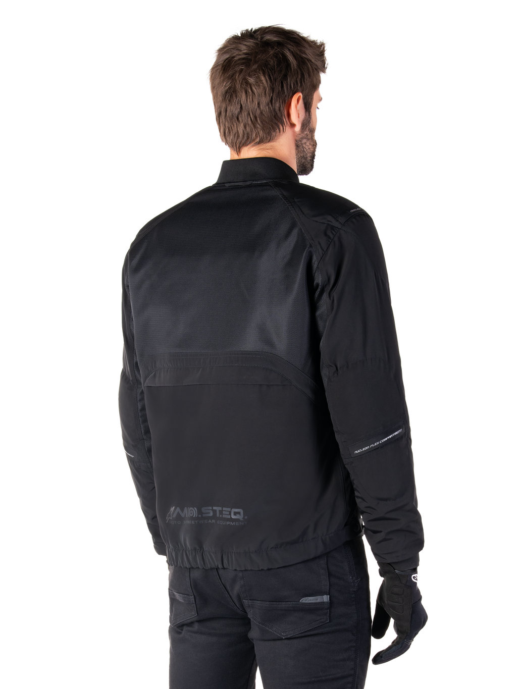 Alpinestars Mootant Waterproof Parka, Black motorcycle jacket, rear view, featuring mesh upper panels and MO.ST.EQ. Moto Streetwear Equipment branding, urban contemporary design for road riding