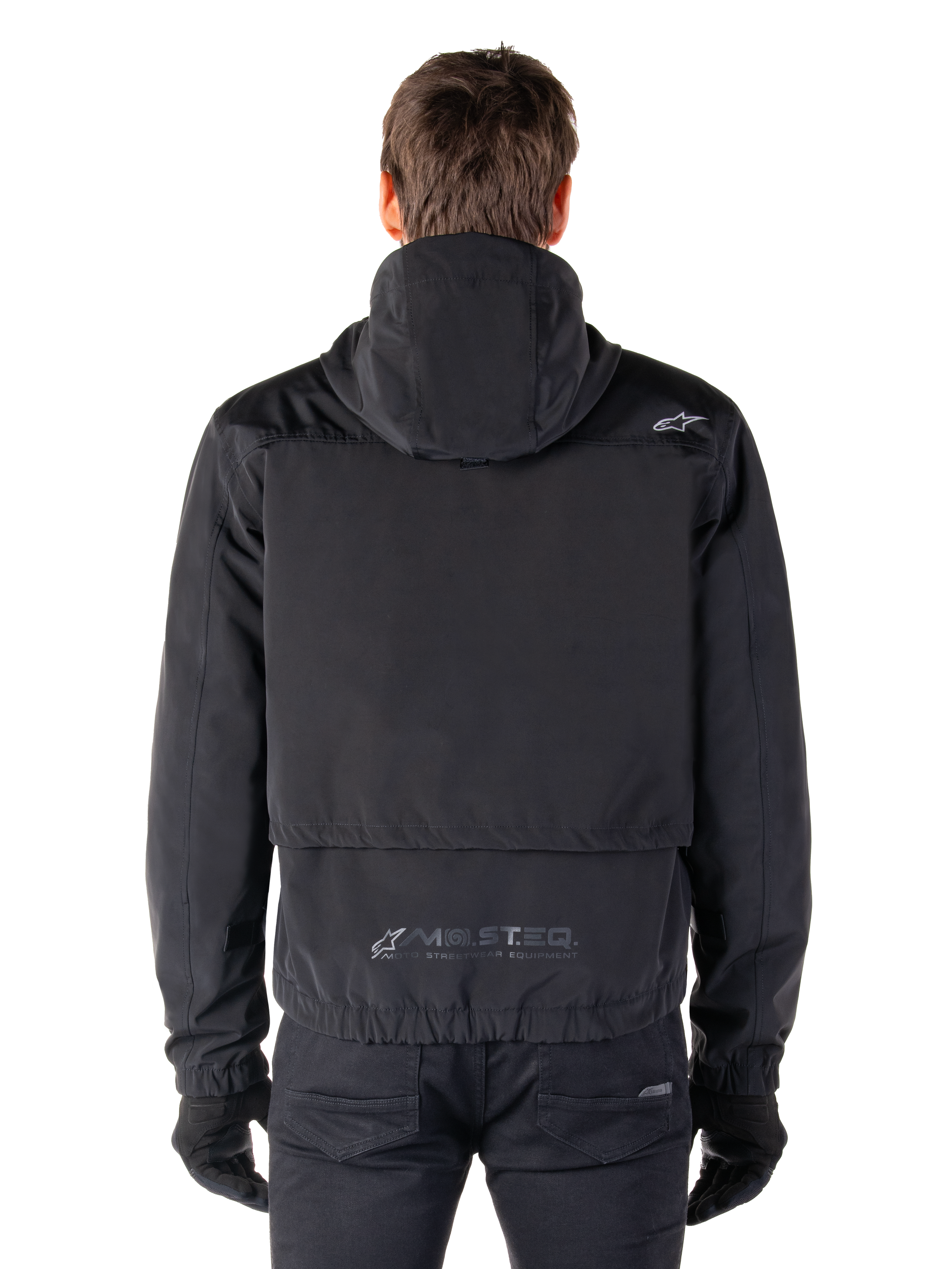 Alpinestars Mootant Waterproof Parka, Black Motorcycle Jacket, rear view showing hooded design, featuring small Astar logo on the shoulder and MO.ST.EQ. reflective branding on the lower back