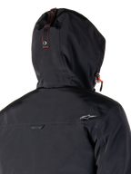 Parka imperméable Alpinestars Mootant, veste de moto, orange épicé et noir, dotée d'un design modulaire 4 saisons avec une capuche amovible, un style militaire utilitaire et une construction en textile imperméable pour rouler par tous les temps.