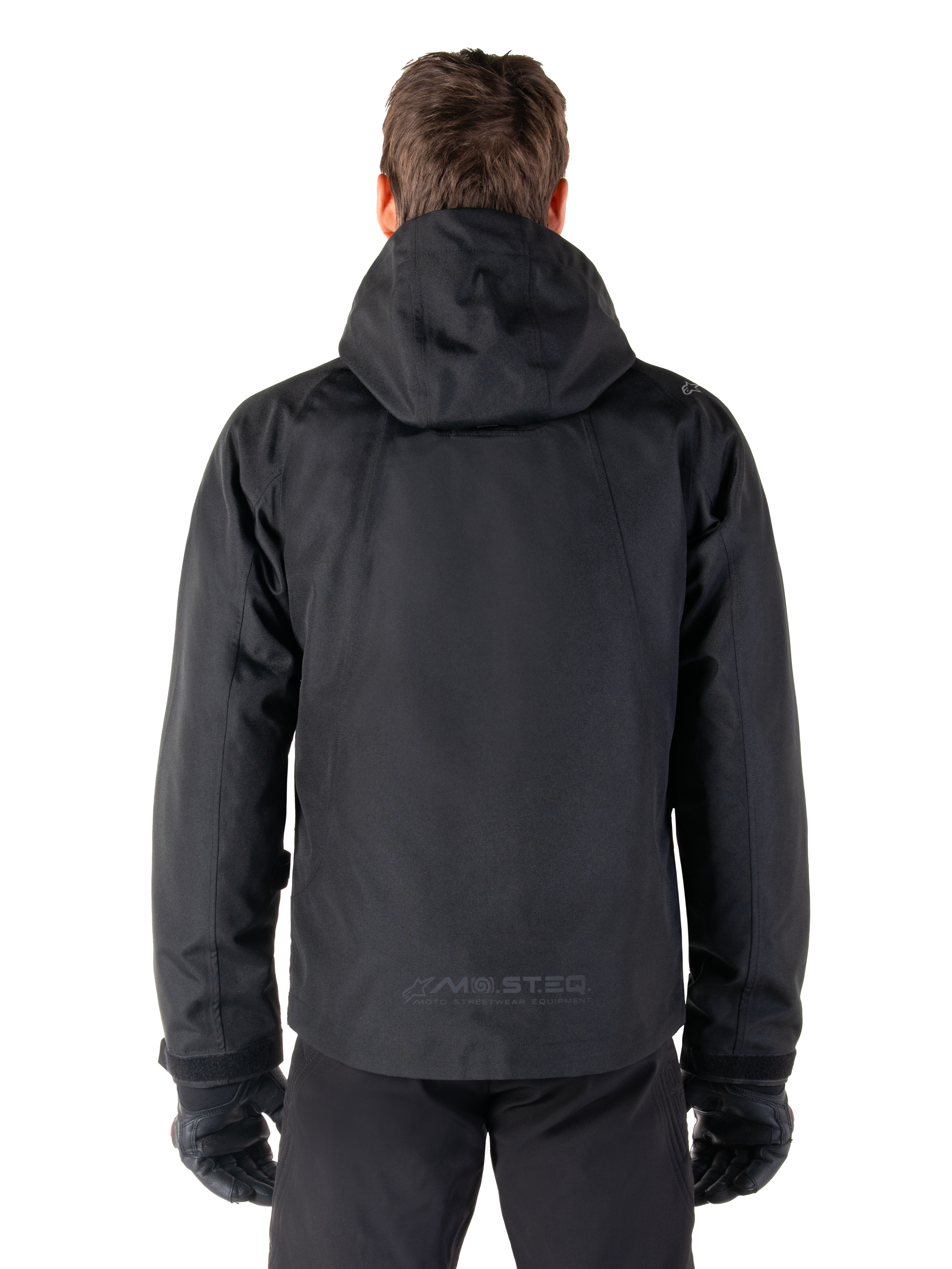 Alpinestars Morush Wasserdicht Parka, schwarze Herren-Motorradjacke, Rückansicht mit Kapuze und reflektierendem MO.ST.EQ. Logo.