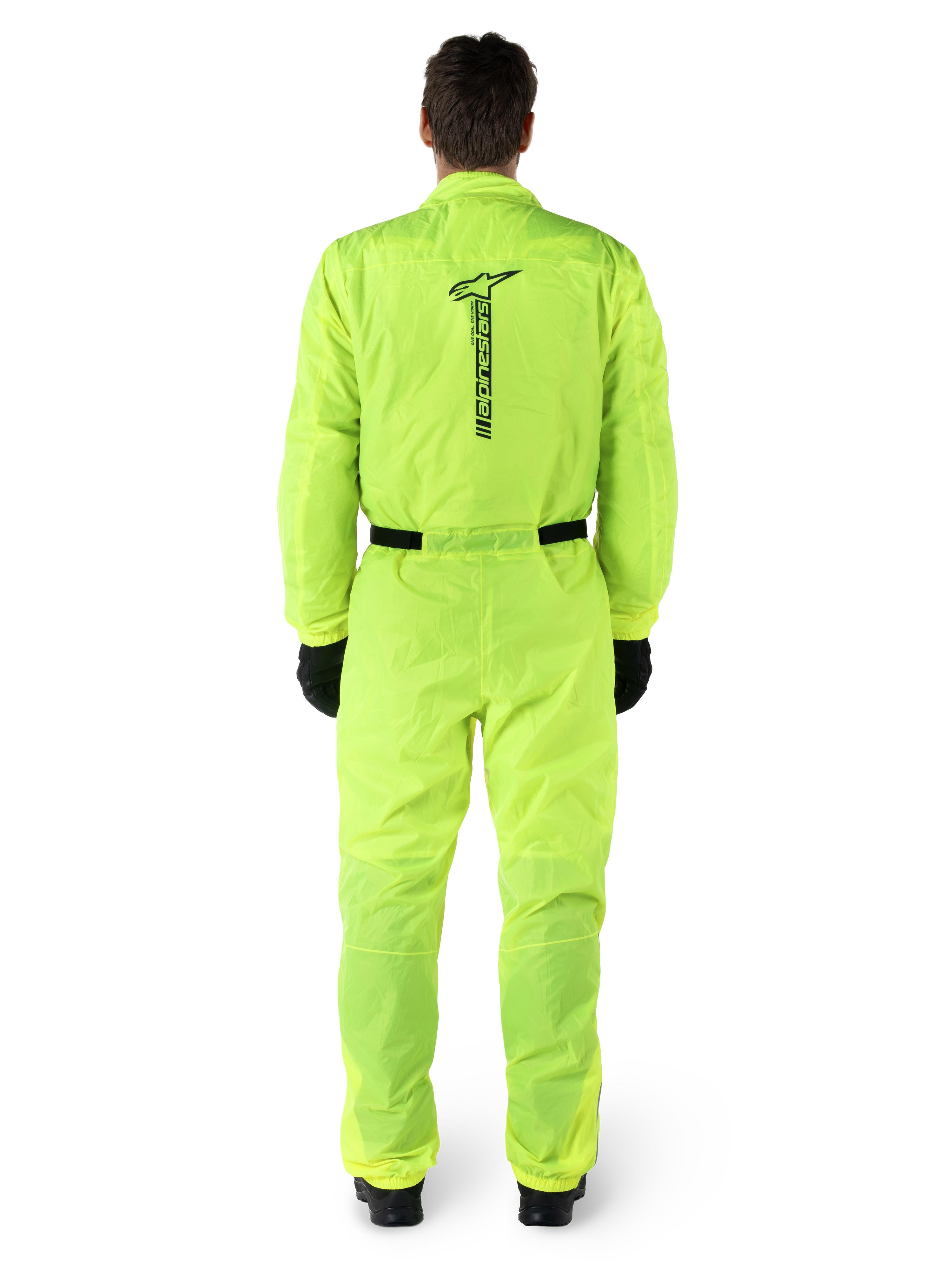 Alpinestars Hurricane Rain V2 Suit, One-piece Motorcycle Rain Suit, Yellow Fluo, back view featuring vertical black Alpinestars branding, elasticated waist and cuffs, worn with black gloves and boots, waterproof and wind-resistant riding gear