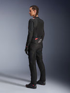 Alpinestars Woman Stella T-Sps Air v2 Jacket, Black and Diva Pink, textile motorcycle jacket shown from a rear-side view, featuring large mesh panels for airflow and white star logo on the back, worn with matching black riding pants, gloves, and boots.