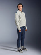 Alpinestars Circal-1 Air Jacket in Metal Gray and Methyl Blue, worn by a model with dark blue jeans and gray sneakers, urban summer motorcycle jacket featuring large mesh airflow panels and a minimalist design.
