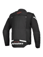 Veste Alpinestars T-Stunt Air, vue arrière, noir et blanc, avec un logo étoile rouge sur le col, un marquage blanc au bas du dos et des fermetures éclair verticales pour le système de flux d'air modulaire.