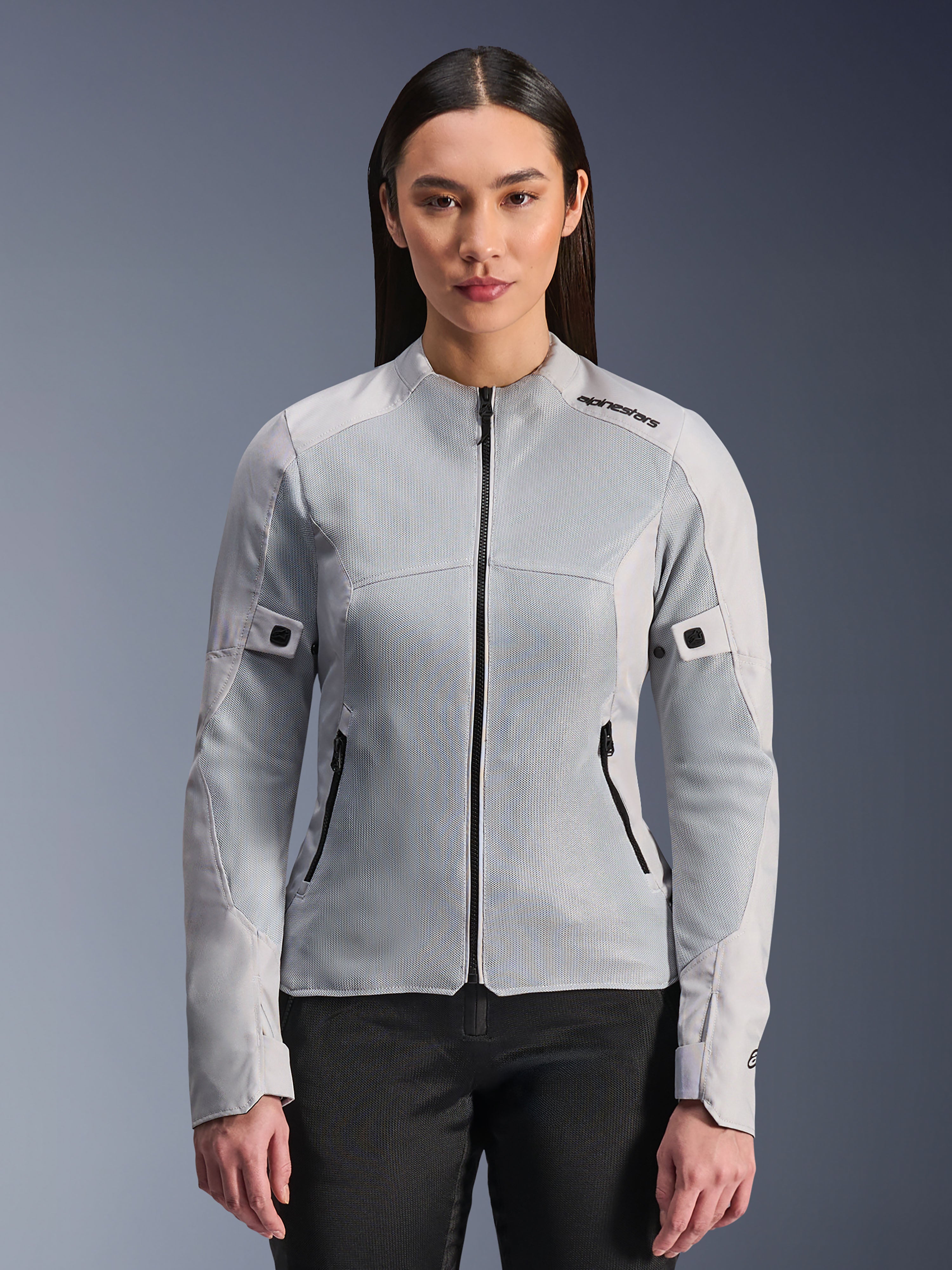 Alpinestars Woman Stella C-1 Air Jacket, Women's Motorcycle Mesh Jacket, Silver, featuring breathable tech mesh panels and black zippers, slim fit summer riding gear worn by a model
