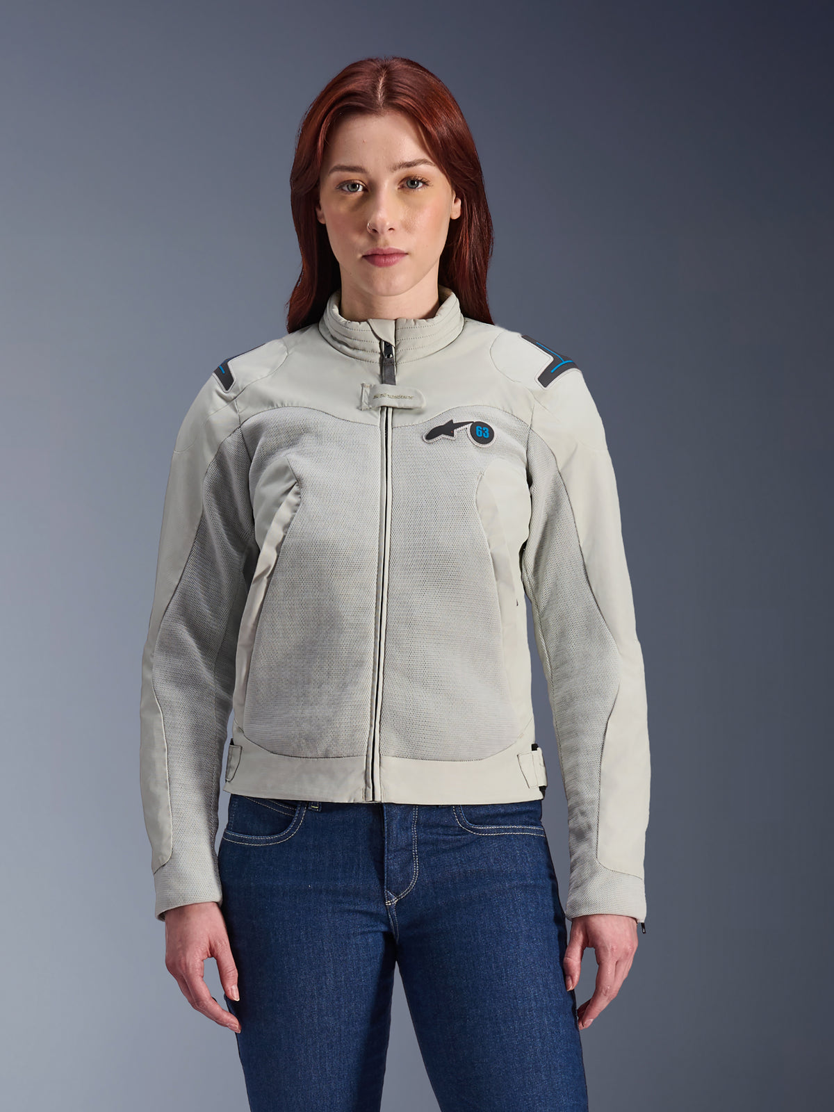 Alpinestars Stella Circal-1 Air Jacket, Women's Motorcycle Jacket, Metal Gray with Methyl Blue accents, mesh airflow panels, zippered front with stand-up collar, worn by model over dark blue jeans