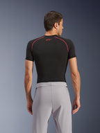 Alpinestars Aeroshell Airflow Pants, Mid Gray, back view, worn with a black short-sleeve base layer with red stitching and logo, featuring lightweight stretch softshell textile and mesh paneling for maximum ventilation, ergonomic sport fit for motorcycle riding