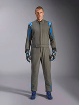 Alpinestars GP Race V3 Suit FIA, Anthracite Blue auto racing suit, worn with matching gloves and racing shoes, featuring bright blue shoulder epaulettes and sleeve stripes, Alpinestars logo details, professional motorsport protection for circuit competition