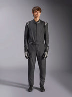 Alpinestars GP Tech V4 Suit, Black and White, professional one-piece auto racing suit, worn with matching black and white gloves and racing shoes, featuring white Alpinestars logos on shoulders and collar, sleek athletic fit for motorsport competition
