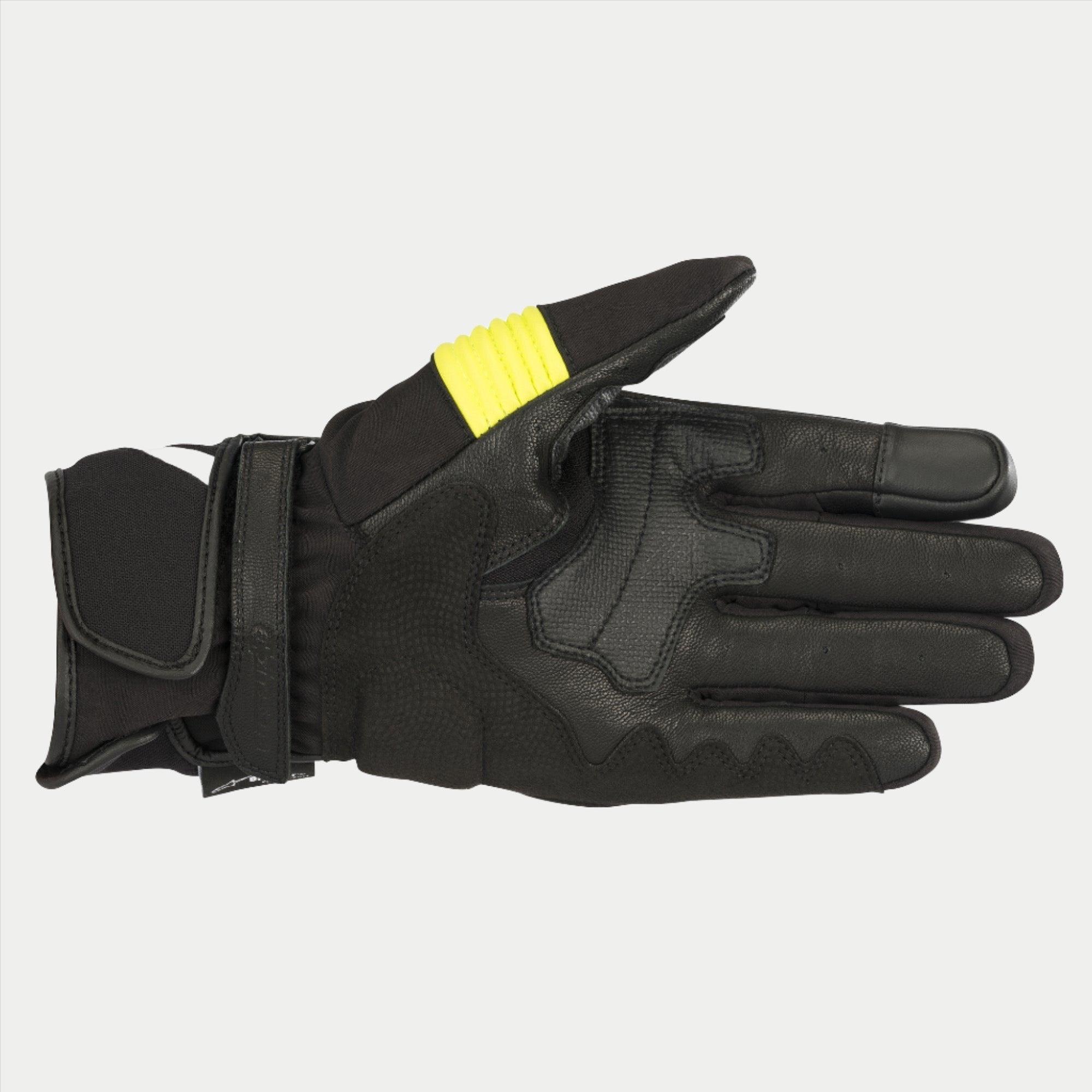 Gants Alpinestars T-SP W Drystar®, Noir et Jaune Fluo, vue de la paume montrant la construction en peau de chèvre avec des accents jaune fluo sur le pouce, extrémités des doigts compatibles avec les écrans tactiles et double fermeture velcro au poignet.