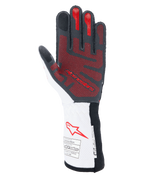 Gants Alpinestars Tech-1 ZX V4, gants de course automobile, noir, blanc et rouge, vue de la paume avec motif d'adhérence en silicone 3D rouge, manchette blanche avec logo Alpinestars rouge et étiquettes de certification FIA et SFI
