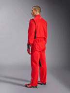 Alpinestars Kart Indoor V2 Suit, Red karting suit, rear three-quarter view on a model, worn with matching red gloves and racing shoes, single-layer poly-cotton twill construction, professional motorsport gear for indoor karting.