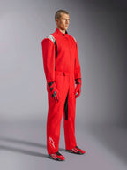 Alpinestars Kart Indoor V2 Suit, Red Karting Suit, worn by a model with matching red and black gloves and shoes, featuring white logos on shoulders and lower leg, black accents, designed for recreational karting and indoor tracks