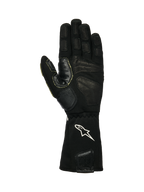 Alpinestars Tech-M V2 Gloves FIA, Pit-Crew Gloves, Black and White, palm view showing textured leather and silicone grip patches, white star logo on the elasticated cuff, designed for motorsport wheel gun use