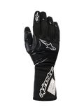 Alpinestars Tech-M V2 Gloves FIA, Black and White Pit-Crew Racing Gloves, featuring an extended cuff with bold Alpinestars branding and FIA certification tag, reinforced knuckle and finger patches for impact protection, professional motorsport gear