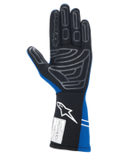 Gants Alpinestars Tech-1 Start V4 FIA, gants de course automobile, bleu royal et noir, vue de la paume avec motif d'adhérence en silicone gris sur les doigts et la paume, manchette allongée avec logo blanc et étiquette d'homologation FIA