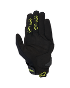 Alpinestars Chrome V2 handschoenen, motorhandschoenen met korte manchet, zwart met neongele accenten, zicht op de handpalm met constructie van synthetisch suède, siliconen gripstippen op de vingers en klittenbandsluiting bij de pols met Alpinestars-branding.
