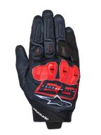 Gants MM93 Spx 1, gants de moto racing, noirs avec des accents rouge vif et blancs, protections de jointures rouges, arborant le logo Marc Marquez 93 et la marque Alpinestars, tissu texturé au design sportif performant
