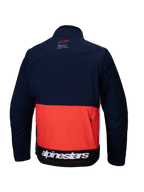 Veste Softshell Alpinestars Lite-Dura en bleu marine, orange vif et blanc, vue de dos présentant un design à blocs de couleurs, une grande poche de rangement arrière zippée et le logo Alpinestars blanc sur l'ourlet inférieur.