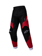 Alpinestars 2025 Kids Racer Veil broek, jeugd motorcrossbroek, zwart en helderrood, witte logo's op de dijen en knieën, witte enkelboorden, voorgevormd ergonomisch ontwerp, duurzaam materiaal voor off-road racen