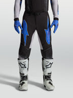 Alpinestars Supertech Hiten AFD broek, heren-motocrossbroek, zwart en blauw, lichtgewicht stretch ripstop constructie.