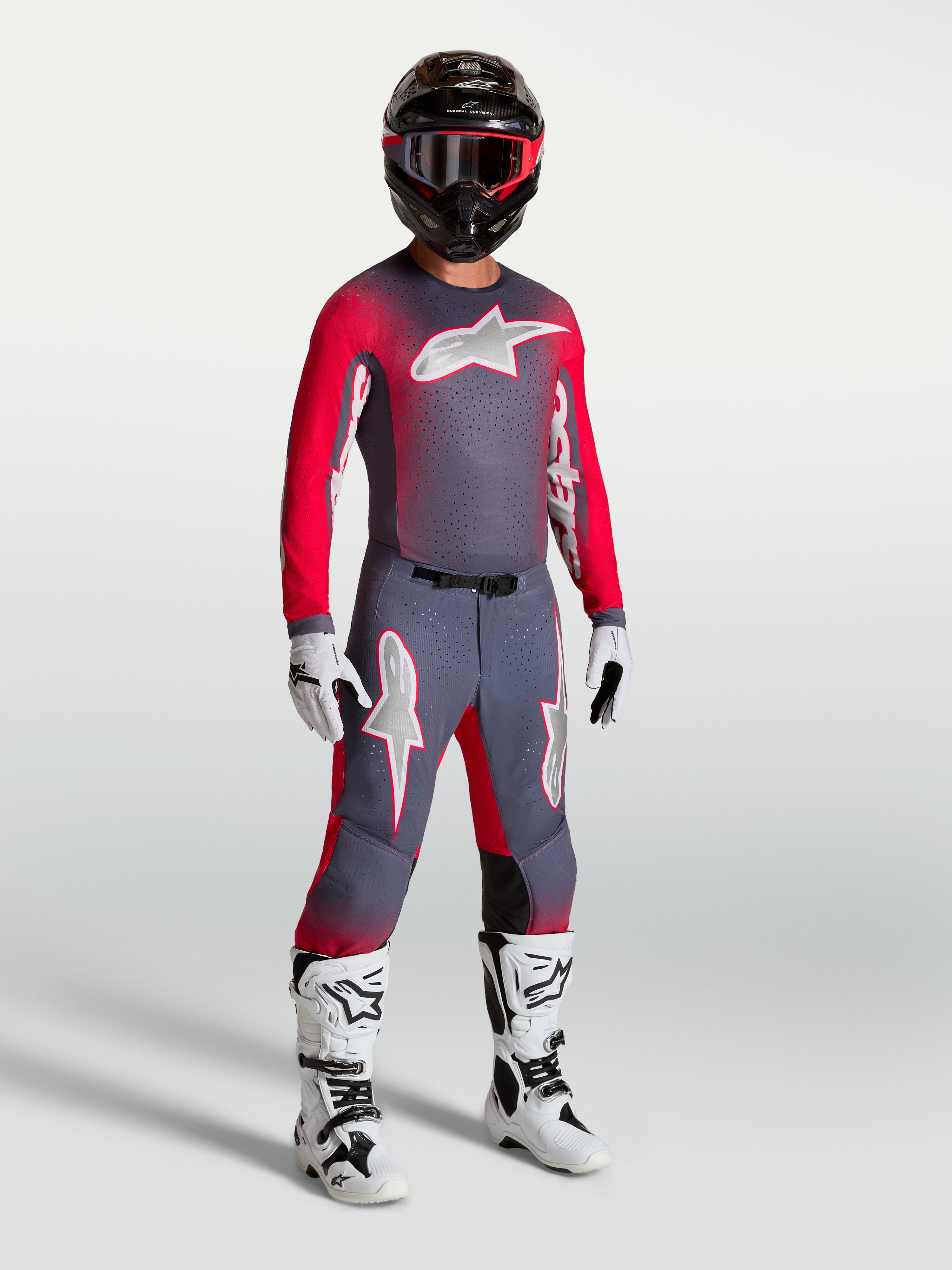 Alpinestars Supertech Hiten AFD broek en gearset, heren motorcross-uitrusting, grijs en fluo rood, atletische pasvorm.