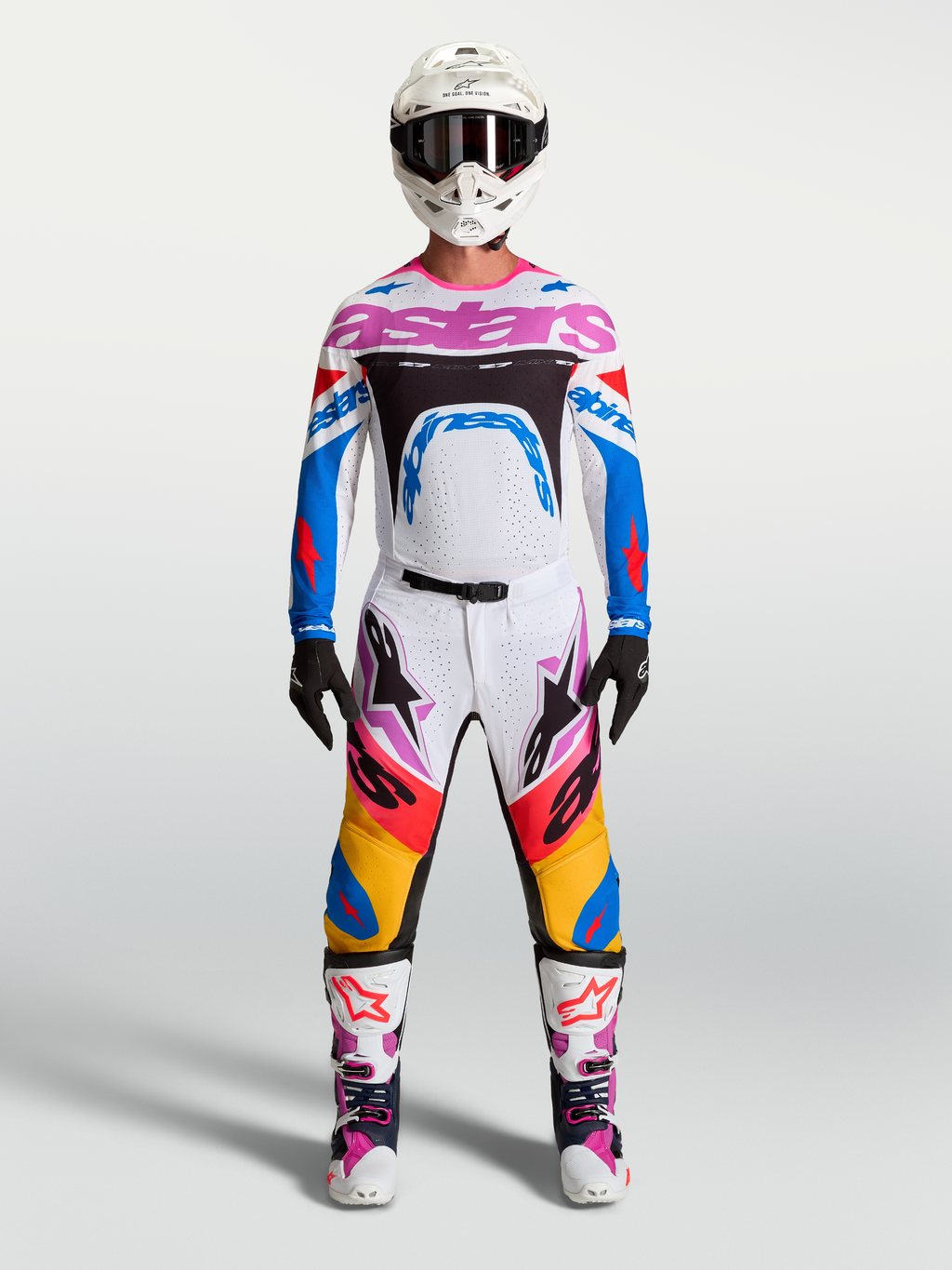 Alpinestars Supertech Dyna, pantalons et équipement de motocross pour homme, blancs et bleus avec accents roses.