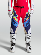 Alpinestars Supertech Dyna broek voor heren, motorcross racing-uitrusting, rood en blauw met gele accenten, geitenleren kniepanelen en magnetische gesp.