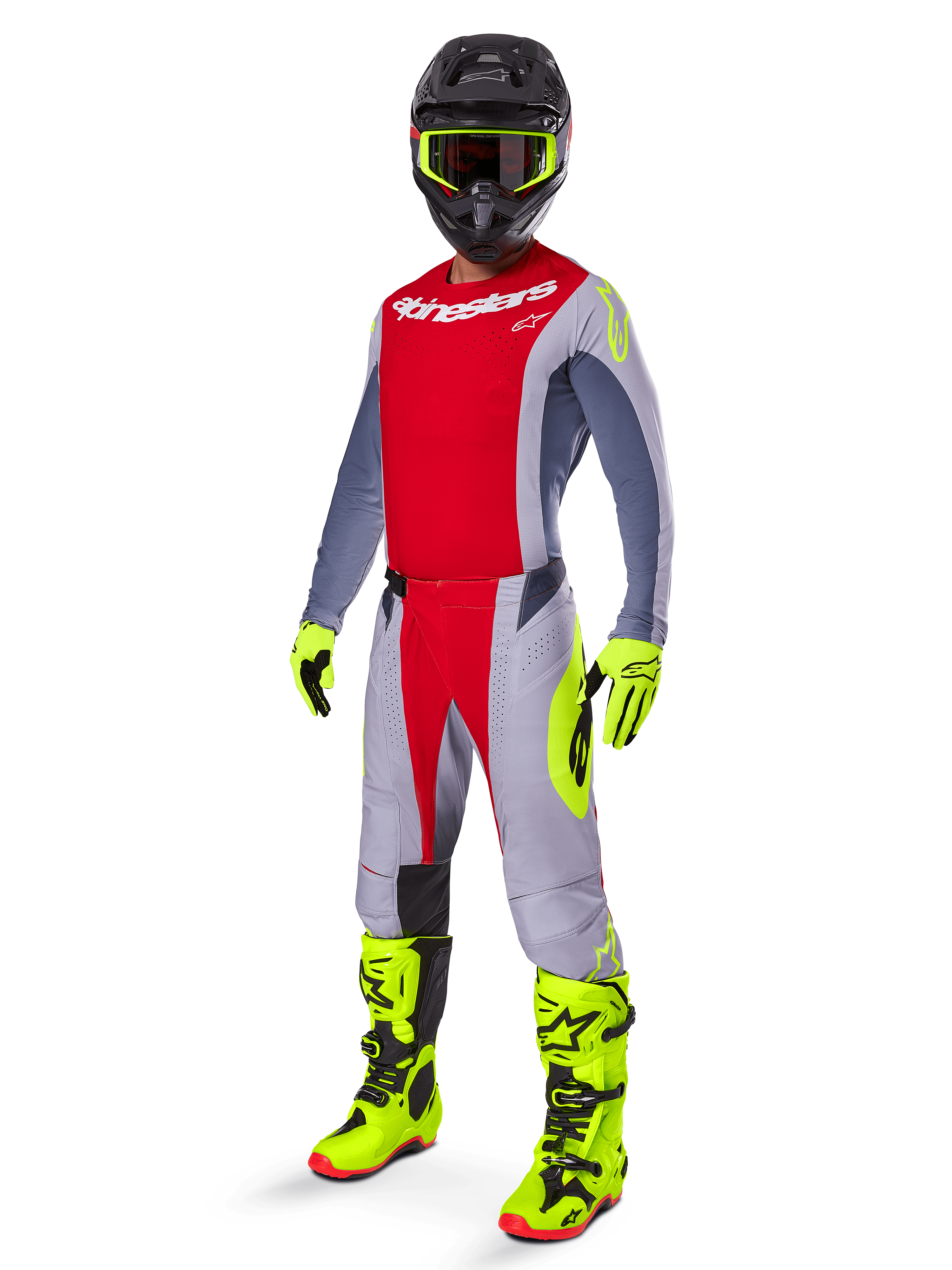 Motocross-Fahrer im Alpinestars 2025 Techstar Melt Gear Set, rotes und graues Jersey und Hose, leuchtend neongelbe Handschuhe und Stiefel, schwarzer Helm, komplette Offroad-Rennausrüstung