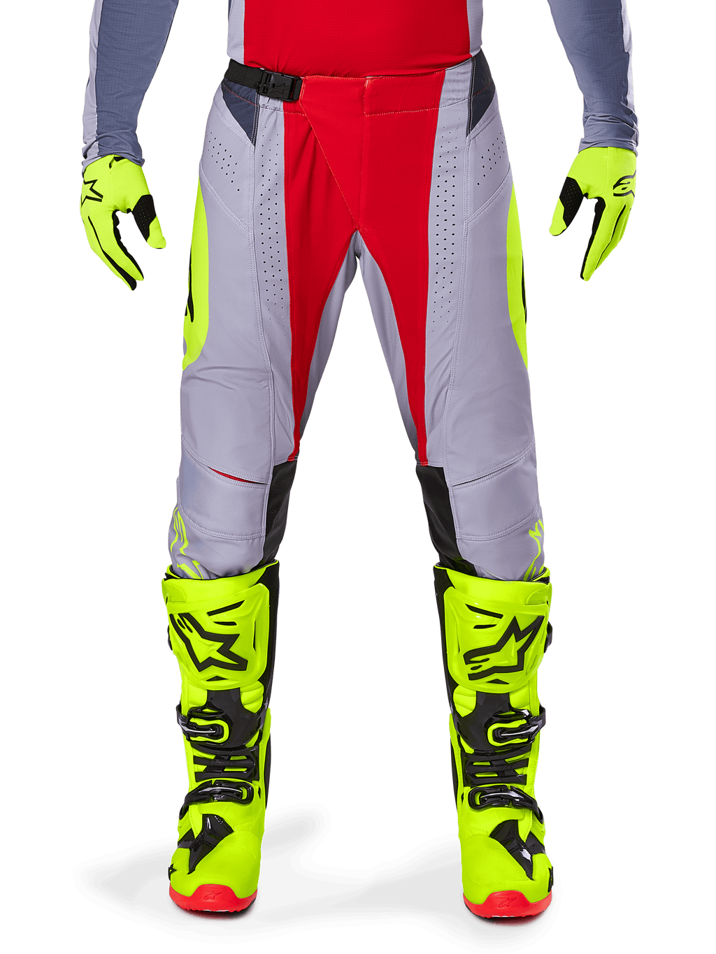 Alpinestars 2025 Techstar Melt Pants, Motocross Pants, Bright Red and Gray with fluorescent yellow accents, worn with matching neon yellow gloves and boots, featuring a magnetic waist buckle and laser-cut perforations for ventilation.