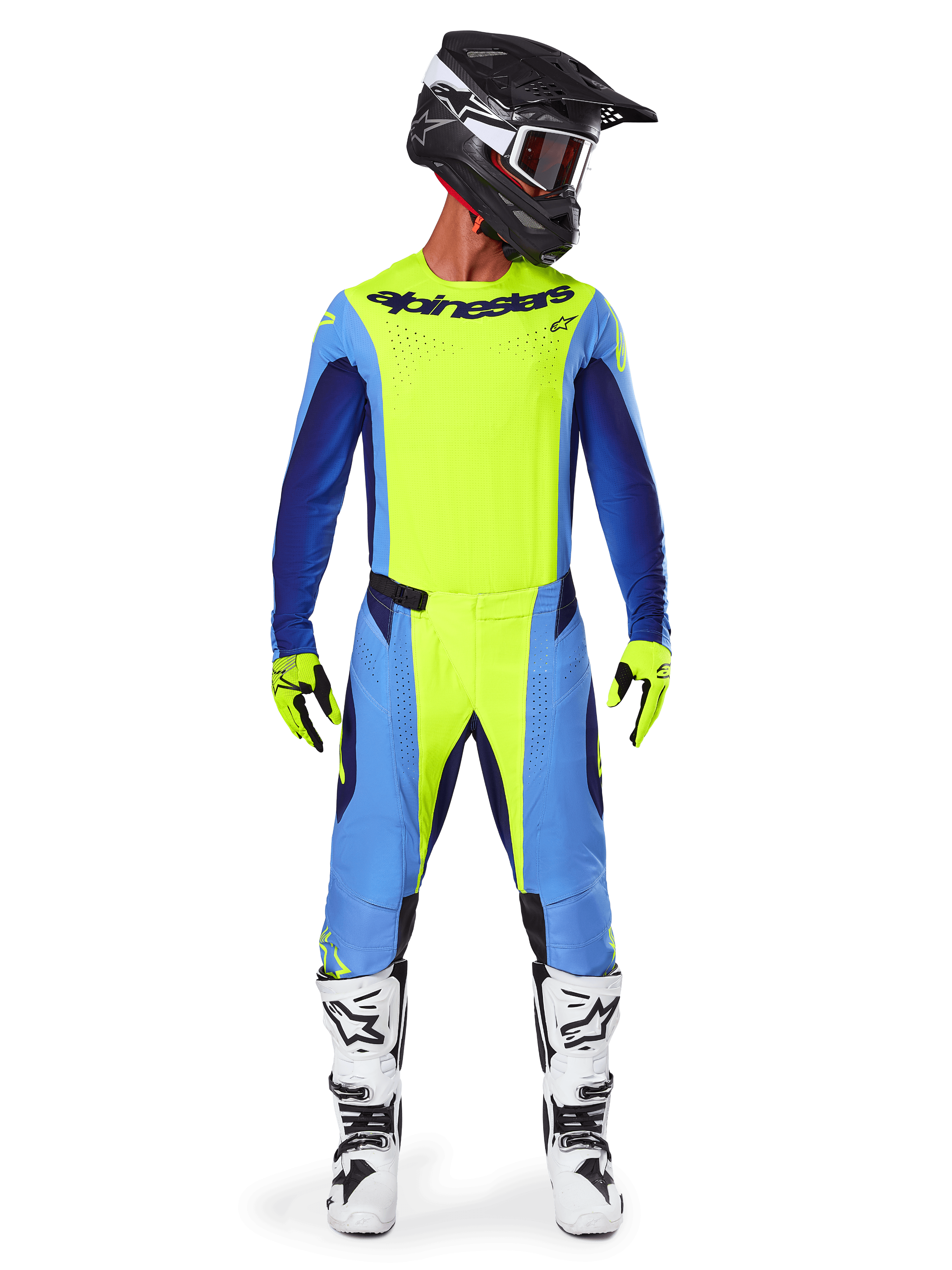 Pilote de motocross portant l'ensemble d'équipement Alpinestars Techstar Melt 2025, maillot jaune fluo avec manches bleues et bleu marine, pantalon assorti jaune et bleu, casque noir et blanc avec lunettes, bottes blanches et noires, gants jaunes et noirs, tenue coordonnée pour la course tout-terrain