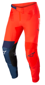 Alpinestars Supertech Blaze Pants, Motocross Off-Road Pants, Bright Red and Dark Blue with White accents, featuring black leather inner knee patches, adjustable ratchet waist closure, white and blue Alpinestars logos, durable stretch construction for motocross racing