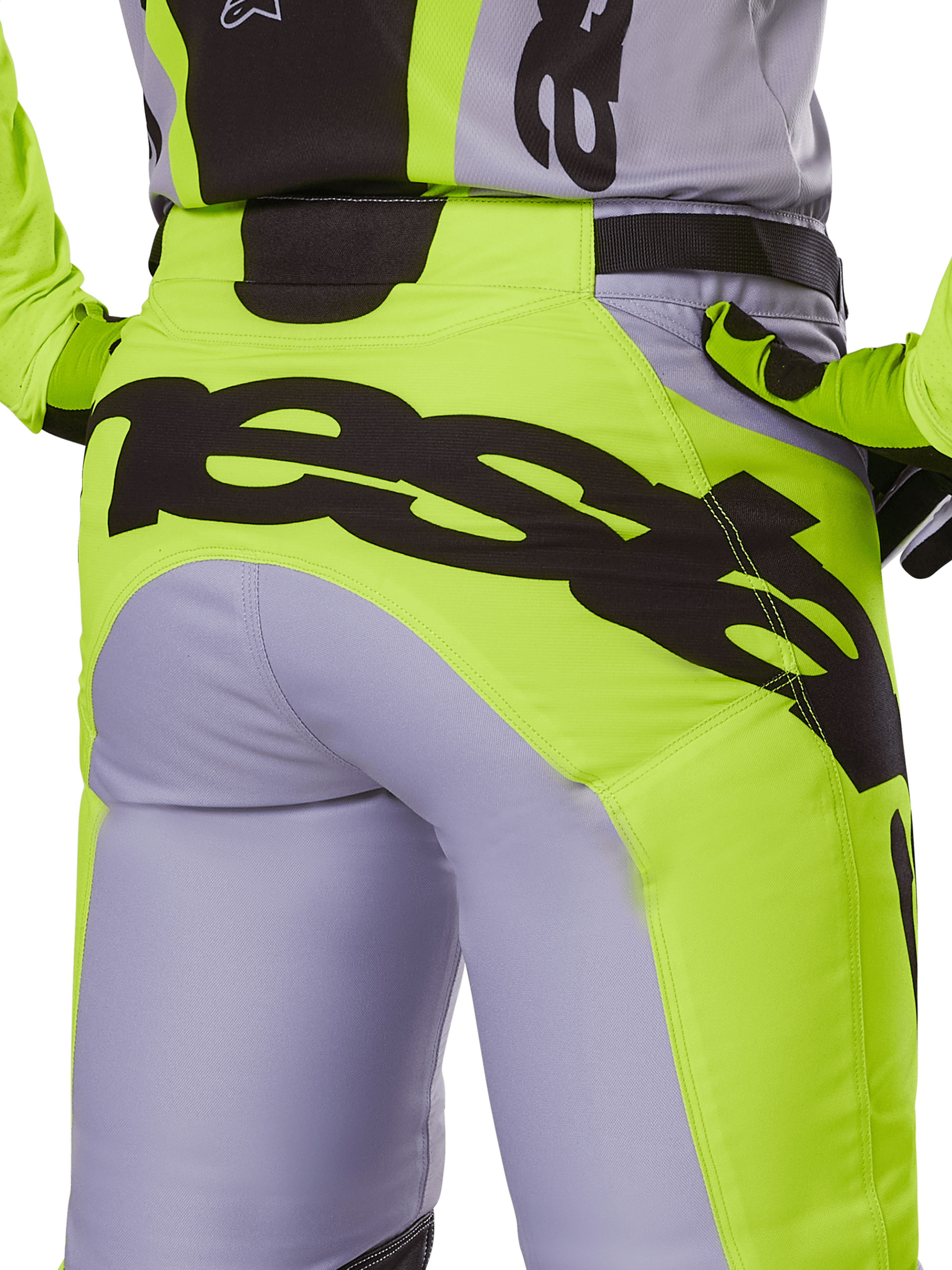 Alpinestars 2025 Racer Veil Pants, Motocross Pants, Gray and Yellow Fluo, rear view featuring large black branding across the seat, worn with matching jersey and gloves, technical off-road design