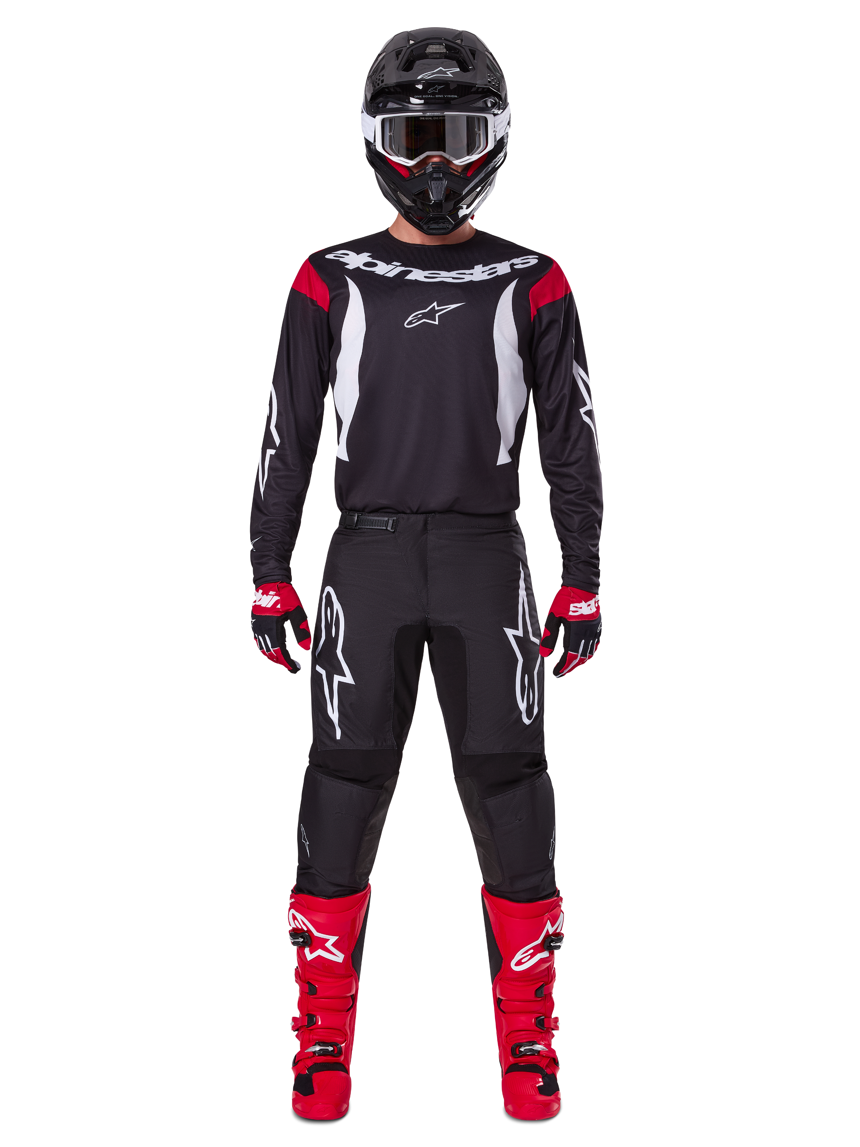 Alpinestars 2025 Fluid Haul Ausrüstungsset, Motocross-Fahrer in kompletter Rennausrüstung, schwarzes Trikot mit roten Schulterakzenten und weißen Logos, schwarze Hose mit weißem Stern-Branding, leuchtend rote Stiefel, rot-schwarze Handschuhe, schwarzer Helm mit weißer Brille, abgestimmter Offroad-Performance-Look