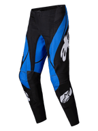 Alpinestars Techstar Dreem Pants 2025, pantalon de motocross, noir et bleu, avec logos Alpinestars blancs, panneaux bleus angulaires sur fond noir, design athlétique avec genoux renforcés pour performance tout-terrain