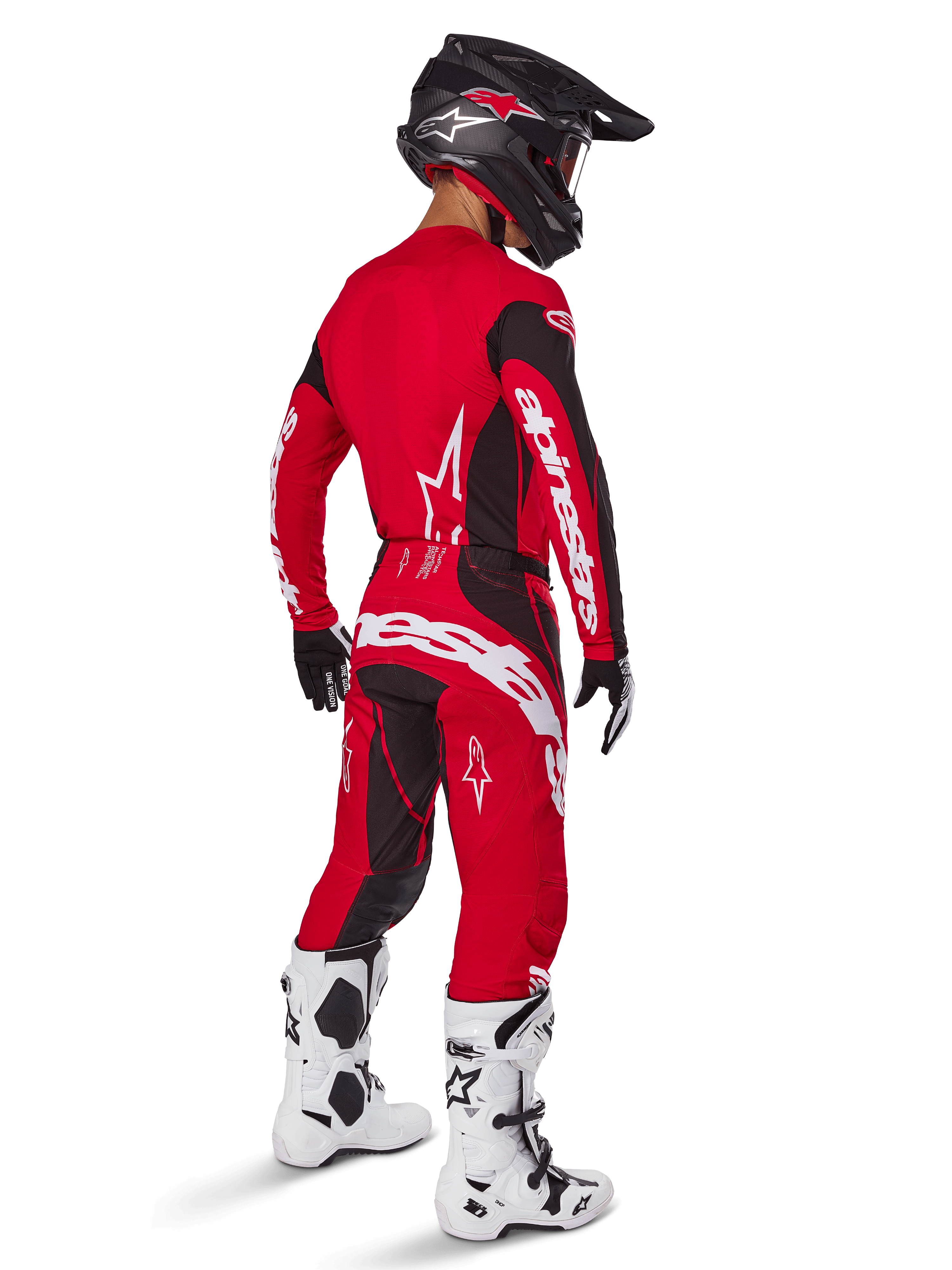 Alpinestars 2025 Techstar Dreem Hose, Motocross-Hose, Hellrot und Schwarz, von einem Fahrer aus der Rückansicht in kompletter Rennausrüstung getragen, mit passendem rotem Trikot, schwarzem Helm und weißen Stiefeln, markantes weißes Alpinestars-Branding und schwarze Stretch-Einsätze.