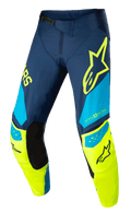 Alpinestars Techstar Factory broek, motorcross racingbroek, donkerblauw, fluogeel en lichtblauw, met zwarte binnenkniepanelen, geel sterlogo op de dij, "ONE GOAL ONE VISION" branding en geperforeerde ventilatiezones voor hoogwaardige off-road kleding