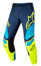 Alpinestars Techstar Factory broek, motorcross racingbroek, donkerblauw, fluogeel en lichtblauw, met zwarte binnenkniepanelen, geel sterlogo op de dij, "ONE GOAL ONE VISION" branding en geperforeerde ventilatiezones voor hoogwaardige off-road kleding