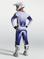 Alpinestars Racer Air Amber Pants, Men's Blue and White Motocross Pants, high-airflow perforated construction, shown from behind on a rider with white boots and helmet.